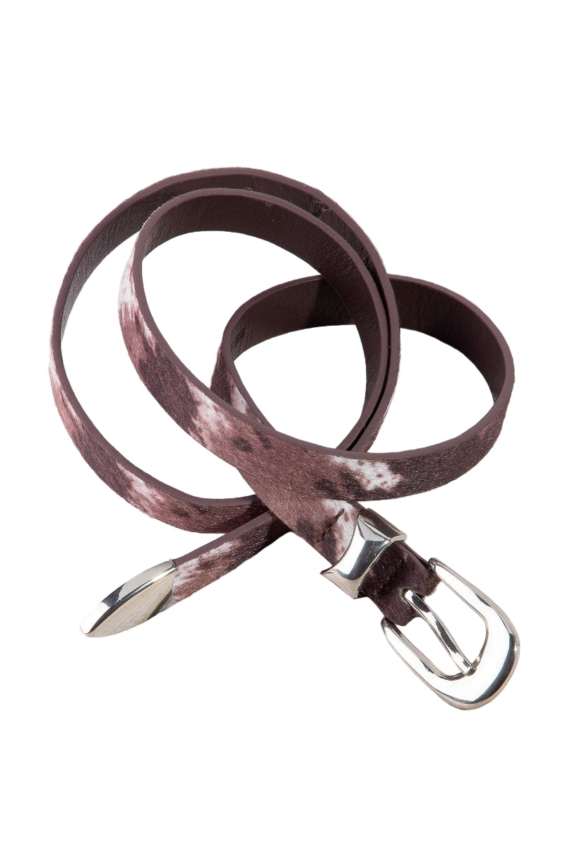 Brown leather belt with silver buckle on a wooden surface